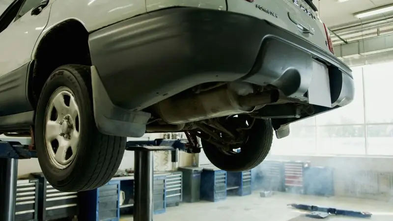Car on a lift in a garage